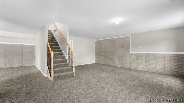 103 Primrose Ln, Camdenton, MO 65020 - below grade area featuring carpet floors, stairway, and brick wall