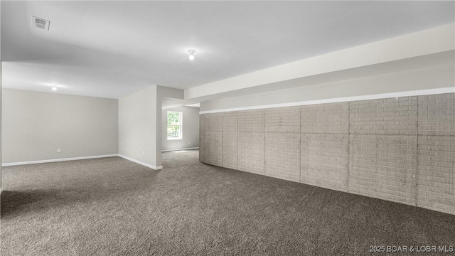 103 Primrose Ln, Camdenton, MO 65020 - below grade area with dark colored carpet and baseboards