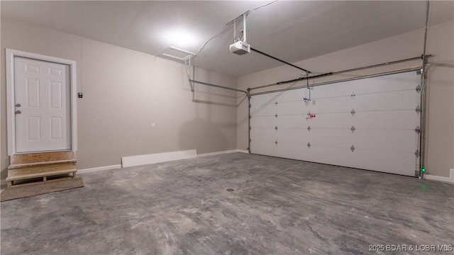103 Primrose Ln, Camdenton, MO 65020 - garage featuring baseboards and a garage door opener