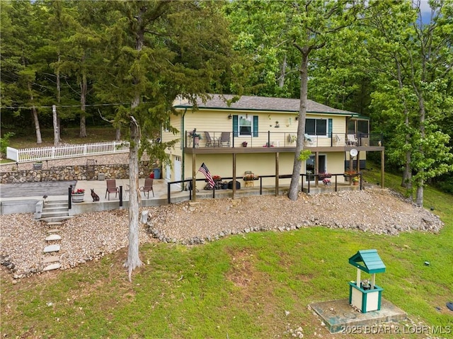73 Good Neighbors Loop, Camdenton, MO 65020 - back of property featuring a patio area, a lawn, and a deck