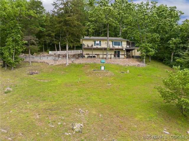 73 Good Neighbors Loop, Camdenton, MO 65020 - view of green lawn featuring a deck and a wooded view