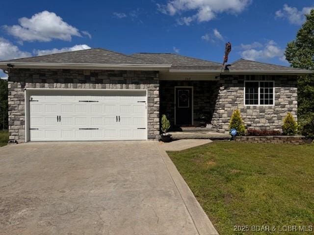 362 Merlin Dr, Camdenton, MO 65020 - view of front of house featuring driveway, a garage, a front yard, and stone siding