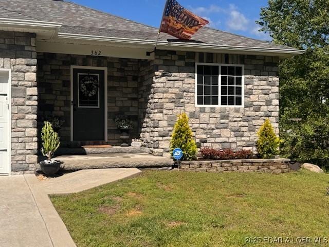 362 Merlin Dr, Camdenton, MO 65020 - doorway to property with a yard, stone siding, and roof with shingles