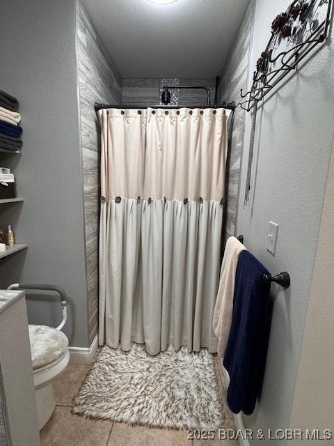 362 Merlin Dr, Camdenton, MO 65020 - full bath featuring tile patterned floors, a shower with curtain, toilet, and baseboards