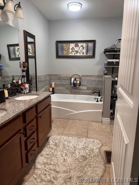 362 Merlin Dr, Camdenton, MO 65020 - bathroom with tile patterned floors, a bath, and double vanity