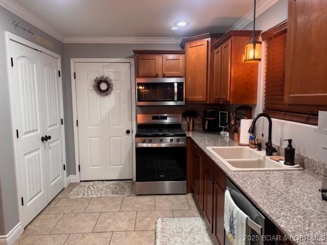 362 Merlin Dr, Camdenton, MO 65020 - kitchen featuring appliances with stainless steel finishes, a sink, brown cabinetry, decorative light fixtures, and ornamental molding