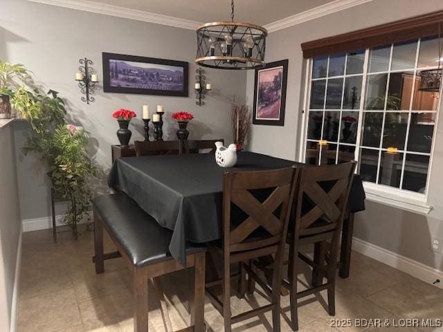 362 Merlin Dr, Camdenton, MO 65020 - tiled dining room with a chandelier, crown molding, and baseboards