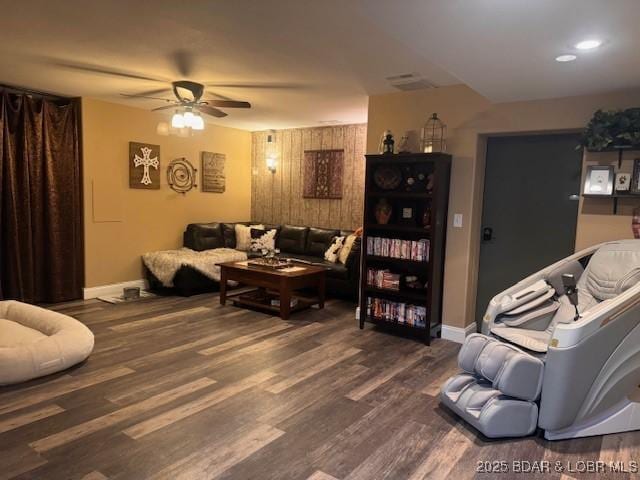 362 Merlin Dr, Camdenton, MO 65020 - living room featuring a ceiling fan, baseboards, and dark wood finished floors