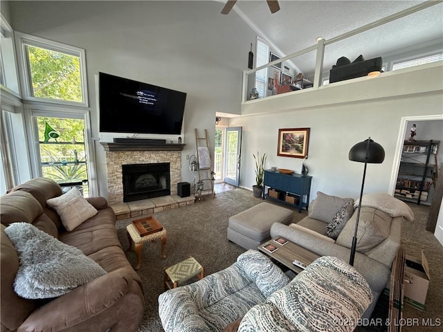 1089 Buckingham Dr Unit 1, Camdenton, MO 65020 - living area featuring carpet flooring, high vaulted ceiling, a fireplace, and plenty of natural light