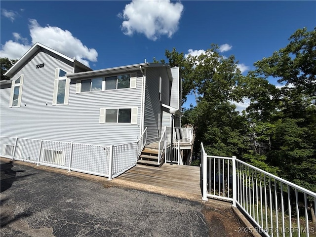1089 Buckingham Dr Unit 1, Camdenton, MO 65020 - rear view of property featuring a deck