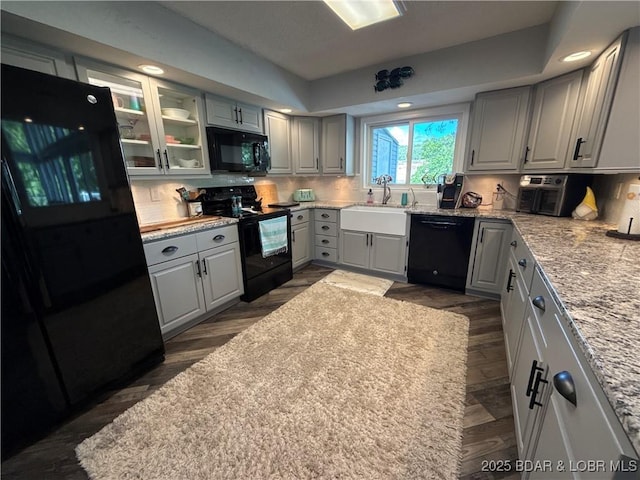 1089 Buckingham Dr Unit 1, Camdenton, MO 65020 - kitchen featuring black appliances, gray cabinetry, backsplash, a sink, and dark wood-type flooring