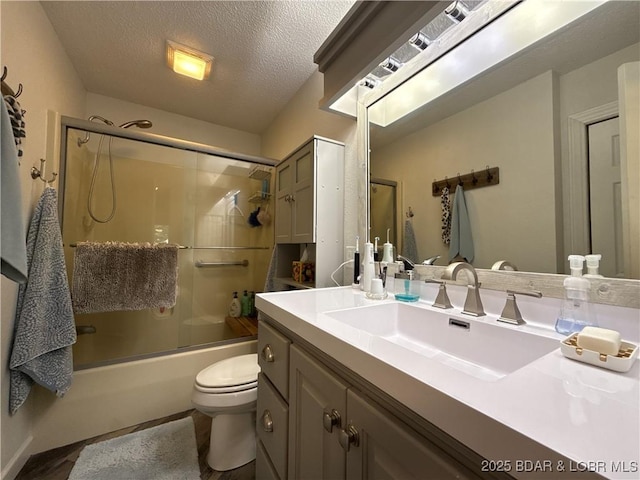 1089 Buckingham Dr Unit 1, Camdenton, MO 65020 - bathroom with toilet, vanity, combined bath / shower with glass door, and a textured ceiling