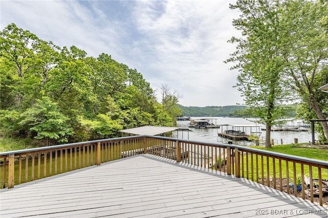 138 Siesta Cir, Camdenton, MO 65020 - wooden deck featuring a water view and a boat dock