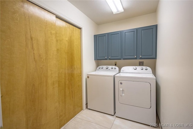 138 Siesta Cir, Camdenton, MO 65020 - laundry area with cabinet space, washing machine and dryer, and light tile patterned flooring