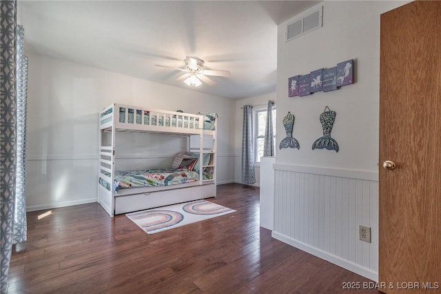138 Siesta Cir, Camdenton, MO 65020 - bedroom featuring wood finished floors, a wainscoted wall, and a ceiling fan