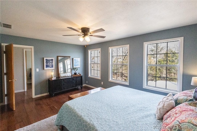 138 Siesta Cir, Camdenton, MO 65020 - bedroom with wood finished floors, baseboards, a ceiling fan, and a textured ceiling