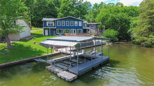 138 Siesta Cir, Camdenton, MO 65020 - dock area featuring a yard and a deck with water view
