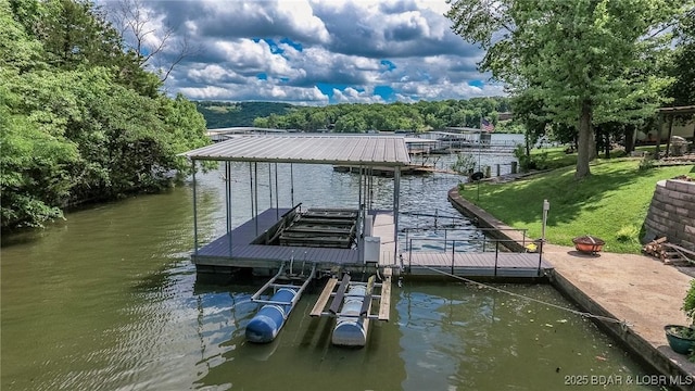 138 Siesta Cir, Camdenton, MO 65020 - dock area featuring boat lift, a water view, a wooded view, and a lawn