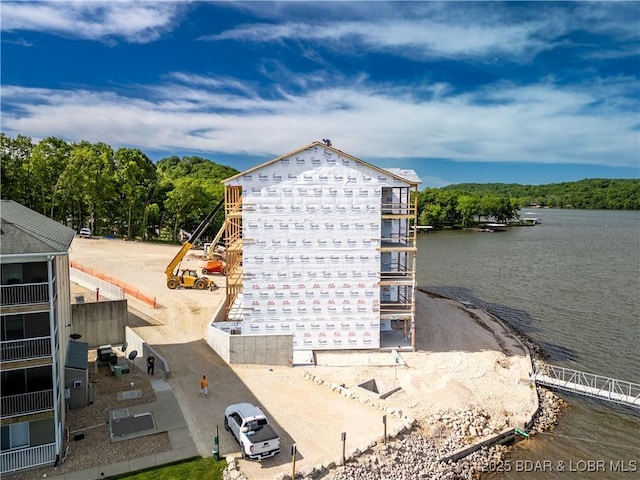 290 Plaza Beach Dr Unit 1C, Camdenton, MO 65020 - exterior space with a boat ramp and a heavily wooded area