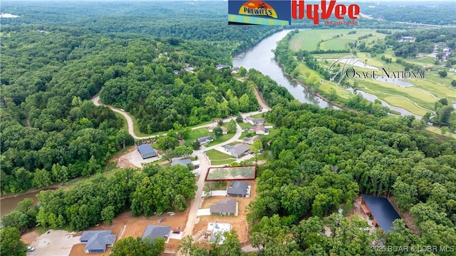 6 Sam Dr, Kaiser, MO 65047 - bird's eye view of a heavily wooded area, a large body of water, and a golf course