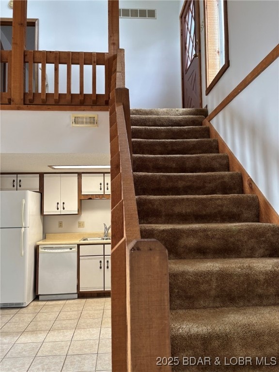 870 Jupiter Rd, Camdenton, MO 65020 - staircase featuring tile patterned flooring