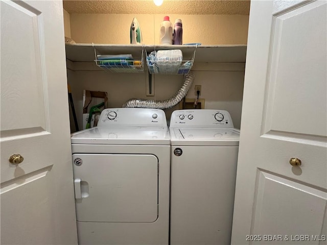 1130 Rachel Rd Unit 108, Osage Beach, MO 65065 - washroom featuring washing machine and dryer, a textured wall, and a textured ceiling