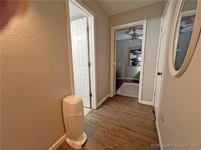 1130 Rachel Rd Unit 108, Osage Beach, MO 65065 - corridor featuring wood finished floors, baseboards, and a textured wall