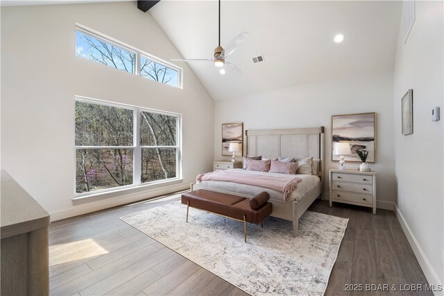 154 Via Cresta Dr, Sunrise Beach, MO 65079 - bedroom featuring high vaulted ceiling, dark wood-style flooring, baseboards, a ceiling fan, and beamed ceiling