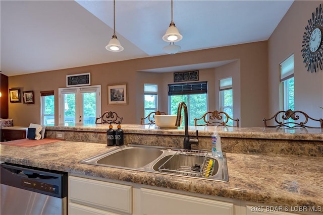 179 Regency Cove Dr, Lake Ozark, MO 65049 - kitchen featuring dishwasher, a sink, plenty of natural light, and white cabinets