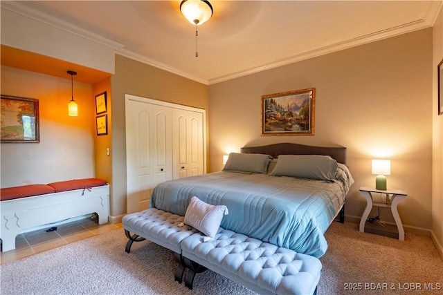 179 Regency Cove Dr, Lake Ozark, MO 65049 - bedroom featuring crown molding, a closet, carpet floors, baseboards, and tile patterned flooring