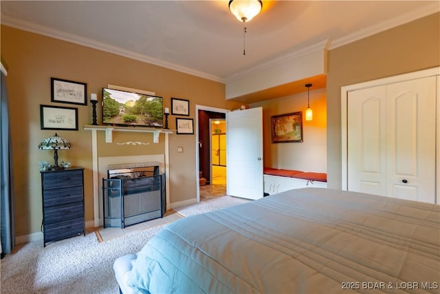 179 Regency Cove Dr, Lake Ozark, MO 65049 - bedroom with light carpet, ornamental molding, baseboards, and a closet