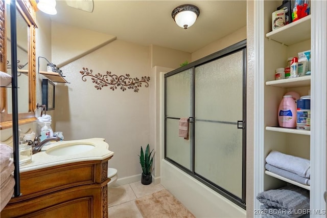 179 Regency Cove Dr, Lake Ozark, MO 65049 - full bath featuring tile patterned floors, vanity, toilet, and combined bath / shower with glass door
