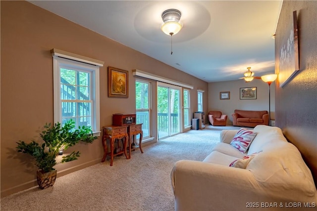 179 Regency Cove Dr, Lake Ozark, MO 65049 - carpeted living area with ceiling fan, healthy amount of natural light, and baseboards