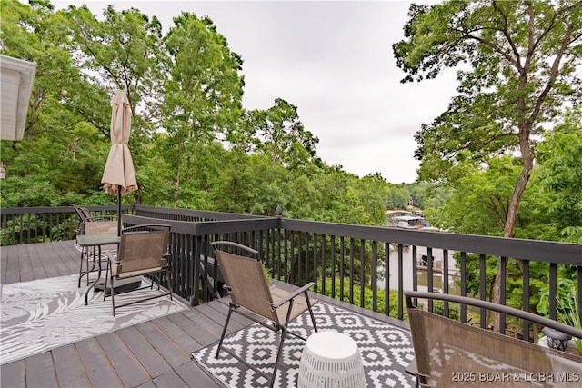 179 Regency Cove Dr, Lake Ozark, MO 65049 - wooden terrace with outdoor dining area