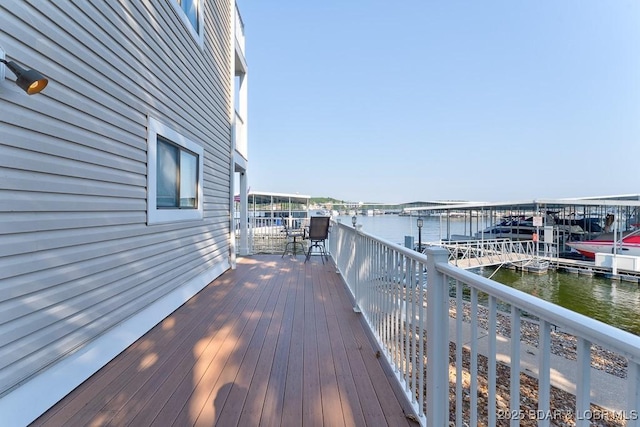 821 Winn Rd Unit 10D, Osage Beach, MO 65065 - wooden deck featuring a water view and a boat dock
