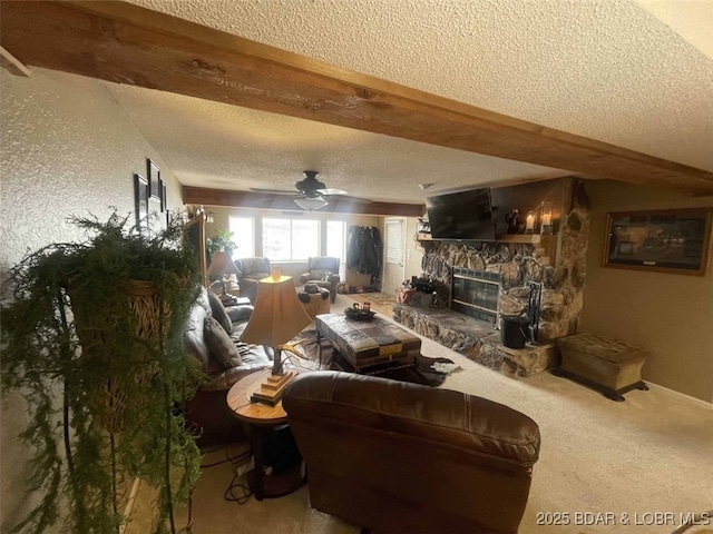 821 Winn Rd Unit 10D, Osage Beach, MO 65065 - living room featuring a textured ceiling, a ceiling fan, a fireplace, carpet, and beamed ceiling
