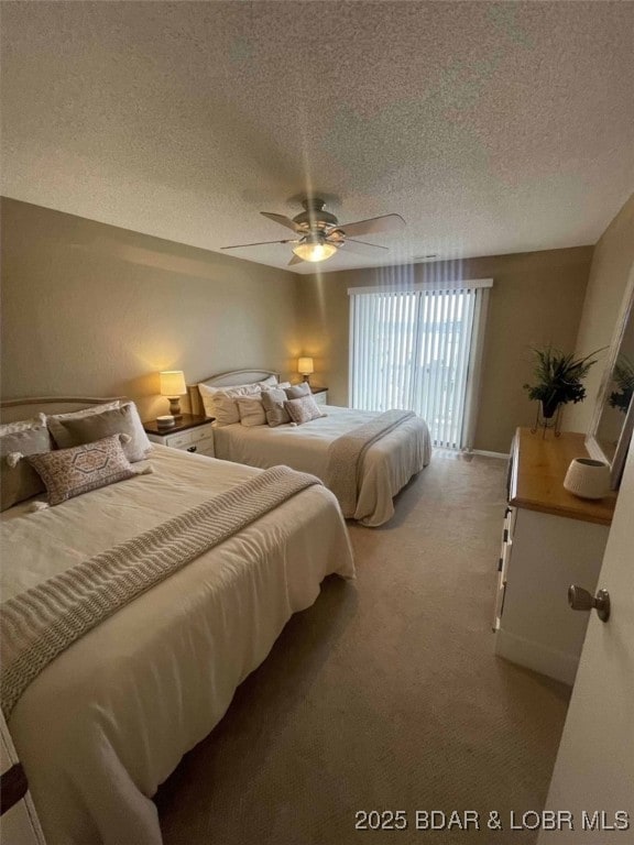 821 Winn Rd Unit 10D, Osage Beach, MO 65065 - bedroom with light carpet, a textured ceiling, and ceiling fan