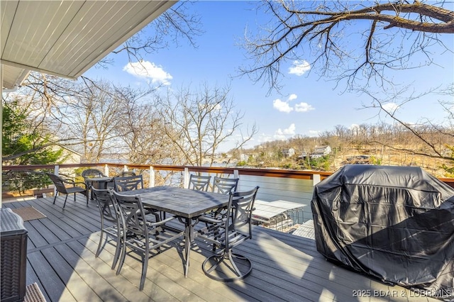 855 Ginger Rd, Lake Ozark, MO 65049 - wooden deck featuring outdoor dining space and a grill