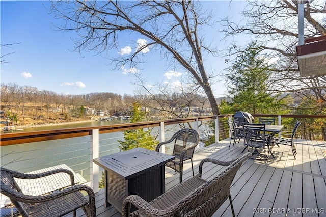 855 Ginger Rd, Lake Ozark, MO 65049 - wooden deck with outdoor dining space and a water view