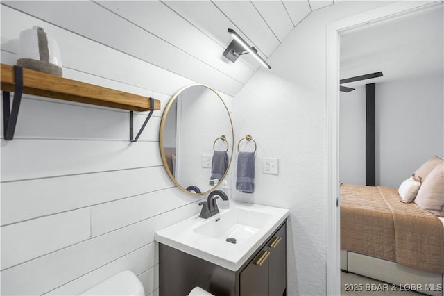 855 Ginger Rd, Lake Ozark, MO 65049 - half bathroom featuring vanity, toilet, and lofted ceiling