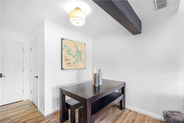 855 Ginger Rd, Lake Ozark, MO 65049 - dining room with wood finished floors, baseboards, and beamed ceiling