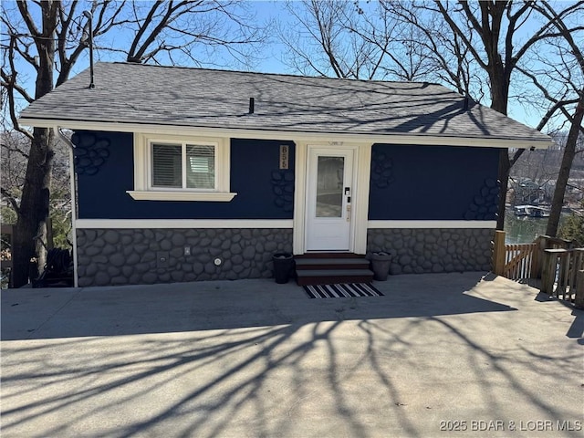 855 Ginger Rd, Lake Ozark, MO 65049 - view of front of property with entry steps, a shingled roof, and stone siding