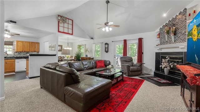 119 Camelot Dr, Camdenton, MO 65020 - carpeted living room with ceiling fan, healthy amount of natural light, a glass covered fireplace, and high vaulted ceiling