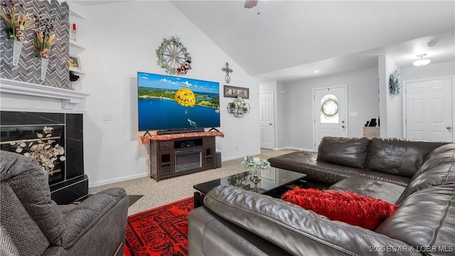 119 Camelot Dr, Camdenton, MO 65020 - carpeted living room with baseboards, high vaulted ceiling, and a premium fireplace