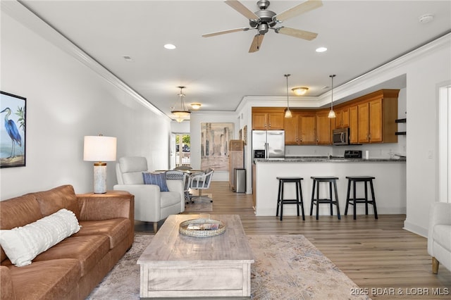100 Trinity Pointe Dr Unit 4M, Camdenton, MO 65020 - living area with crown molding, a ceiling fan, light wood-style floors, and recessed lighting