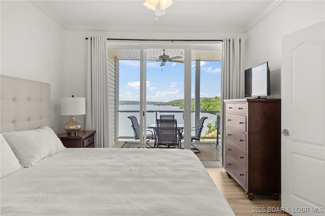 100 Trinity Pointe Dr Unit 4M, Camdenton, MO 65020 - bedroom featuring access to outside, ornamental molding, and light wood-type flooring