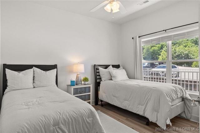 100 Trinity Pointe Dr Unit 4M, Camdenton, MO 65020 - bedroom featuring wood finished floors and a ceiling fan