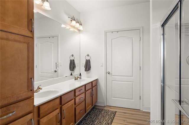 100 Trinity Pointe Dr Unit 4M, Camdenton, MO 65020 - bathroom with double vanity and wood finished floors