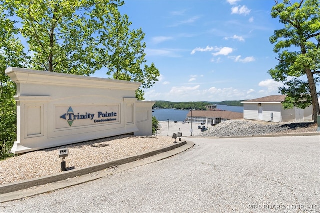 100 Trinity Pointe Dr Unit 4M, Camdenton, MO 65020 - community / neighborhood sign featuring a water view