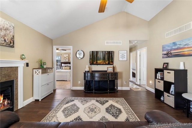 790 College Blvd, Osage Beach, MO 65065 - living room featuring ceiling fan, dark wood-style floors, high vaulted ceiling, a fireplace, and baseboards